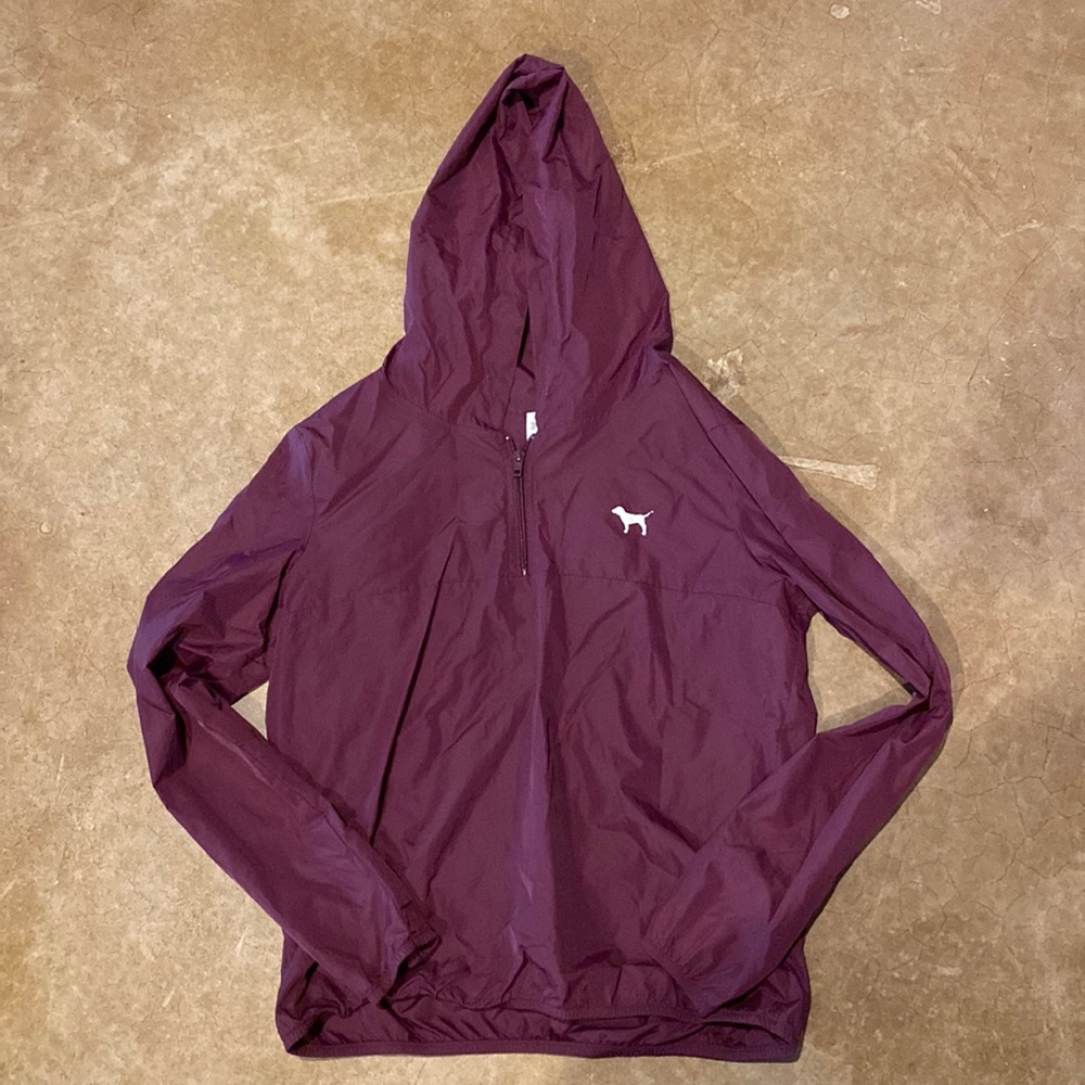 PINK rain jacket that is maroon.